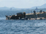HTMS Kut taking in water over the starboard quarter